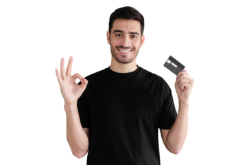 Young man in black t-shirt, holding credit card and showing okay gesture