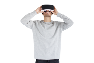 Young man holding virtual reality headset with both hands