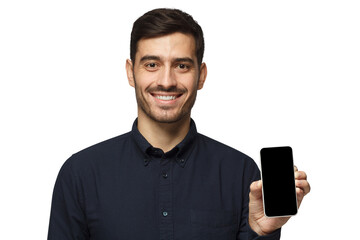 Smiling handsome young man holding phone with blank screen