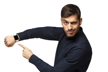 It's time to act! Young man pointing at watch with impatience as if asking to hurry up