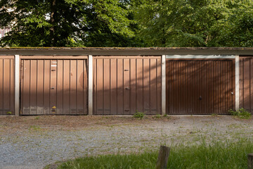 DDR Garage units in a row in East Germany. Exterior of the front of the building with the doors...