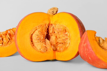 Cut fresh pumpkin on white background