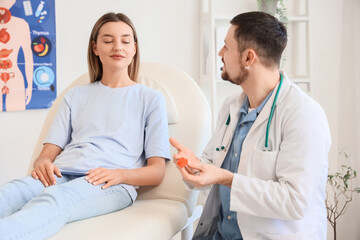 Young woman visiting endocrinologist in clinic