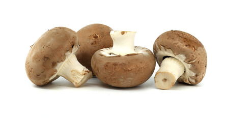 Close-up view of fresh baby bella mushrooms on a white background highlighting their organic texture