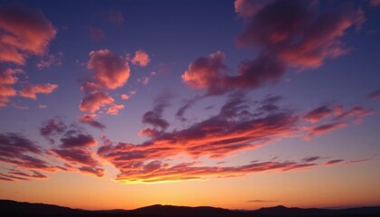 Fototapeta premium arafed sky with clouds and mountains in the background