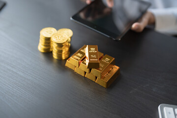 Gold Trading business man hand offering gold Investment in gold mining company or Trading gold on the stock exchange Rising gold prices.