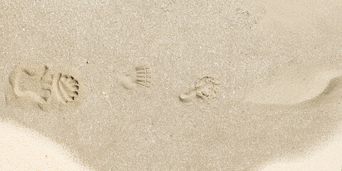 Close-up of a light beige sand texture, ideal as a natural background or surface pattern.