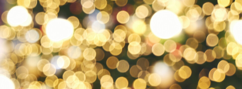 Blurred background golden glitter shiny sparkling banner. Happy Holidays background for template on christmas card brochures posters. Gold bokeh template for digital presentation slideshow background