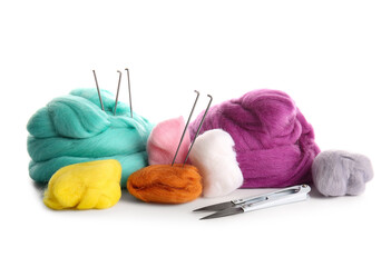 Set of colorful wool for felting with needles and thread cutter on white background