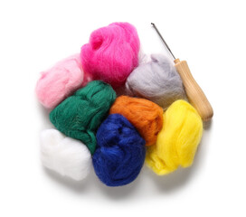 Heap of different wool for felting and needle on white background
