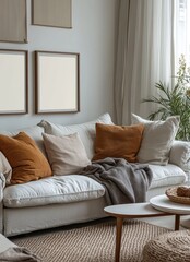 Cozy living room with a white sofa, a grey throw blanket, and a  wooden coffee table.