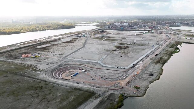 Strandeiland construction site in Amsterdam, early-stage infrastructure development for sustainable housing on this artificial island in IJburg. Aerial view.