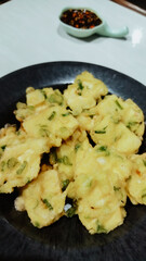 Tempe Goreng or Tempe Mendoan is Indonesian traditional food made from tempeh covered in flour batter.