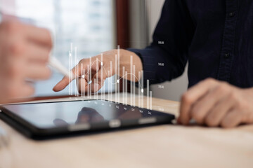 investment and finance concept, businessman touching virtual trading graph and blurred light on...