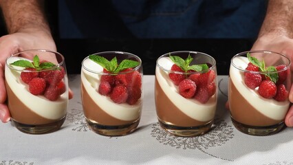 Сlose up of a glass of yogurt with strawberries.