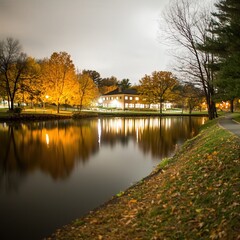 Fototapeta premium Tranquil Evening Reflections in a Serene Park with Autumn Colors and Gentle Ripples