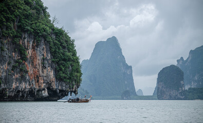 Landscape of Phang Nga bay with a fishing boat. Thailand