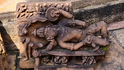Broken sculpture of Sheshasayyi Lord Vishnu in the Kuti Group of Temples, located in Thoban,...