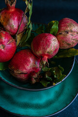 Table setting with ripe pomegranate from the orchard