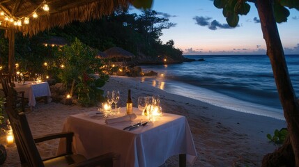 Fototapeta premium Intimate beachside dinner setup with a table for two, decorated with white linens and soft candlelight, perfect for a romantic evening