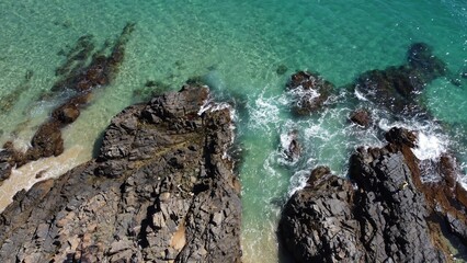 Obraz premium Aerial Shot of Turquoise Water and Rocky Shoreline
