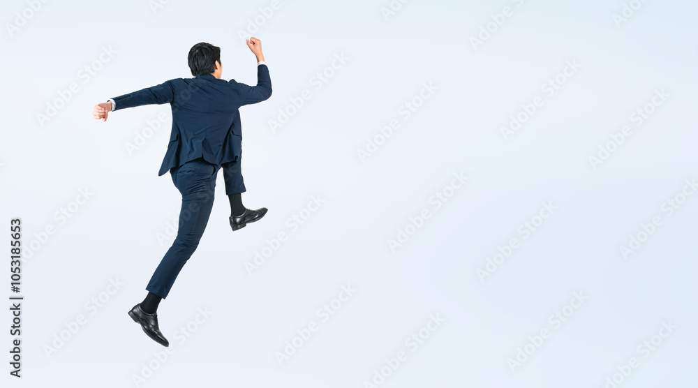 Aufkleber ジャンプする若い男性ビジネスパーソンの後ろ姿の全身写真（切り抜き背景透過pngも販売しております。作成者リンクから「png」で検索してください）