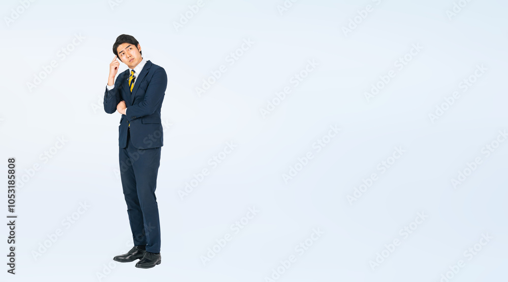 Aufkleber 考える若い男性ビジネスパーソンの全身写真（切り抜き背景透過pngも販売しております。作成者リンクから「png」で検索してください）