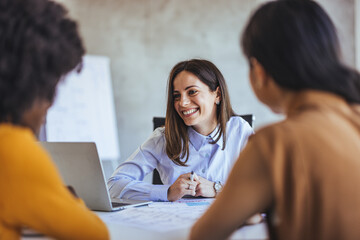 Smiling Businesswoman Leading a Productive Team Meeting