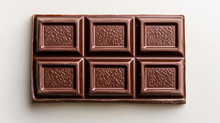 Dark Chocolate Bar: A delectable overhead shot of a dark chocolate bar, segmented into squares, ready to be broken and enjoyed.  The rich brown color and textured surface invite indulgence. 