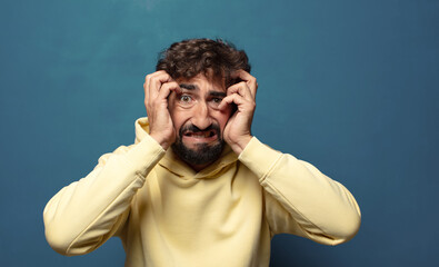 feeling stressed, worried, anxious or scared, with hands on head, panicking at mistake