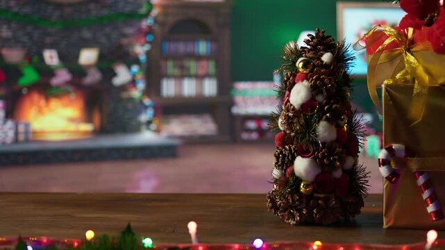 Empty cozy log cabin decorated with festive garlands and ornaments, quiet North Pole workshop where Santa and his elves working on making toys. Space with colorful decorations. Close up.
