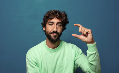 holding an object ,showing, offering or advertising something small