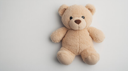 Obraz premium Teddy Bear's Embrace: A soft, cuddly teddy bear, a classic symbol of childhood innocence and comfort, captured in a simple yet endearing pose. The perfect image for evoking warmth and nostalgia.