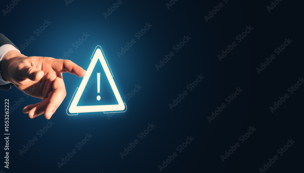 Poster close up of male hand pointing at glowing attention sign on dark background with mock up place. impo