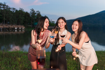 Asian women celebrating, meeting and chatting in a bar. Places to visit, beautiful lights