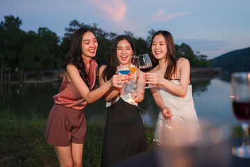 Asian women celebrating, meeting and chatting in a bar. Places to visit, beautiful lights