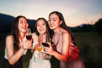 Asian women celebrating, meeting and chatting in a bar. Places to visit, beautiful lights