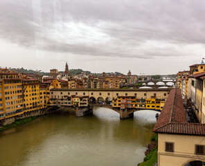 Obraz premium Old bridge on the river, Ponte Vecchio in Florence