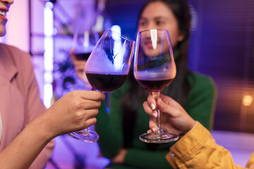 Asian women celebrating, meeting and chatting in a bar. Places to visit, beautiful lights