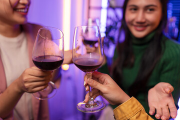 Asian women celebrating, meeting and chatting in a bar. Places to visit, beautiful lights