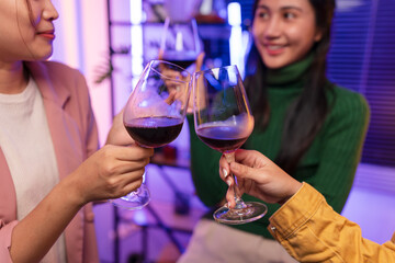 Asian women celebrating, meeting and chatting in a bar. Places to visit, beautiful lights