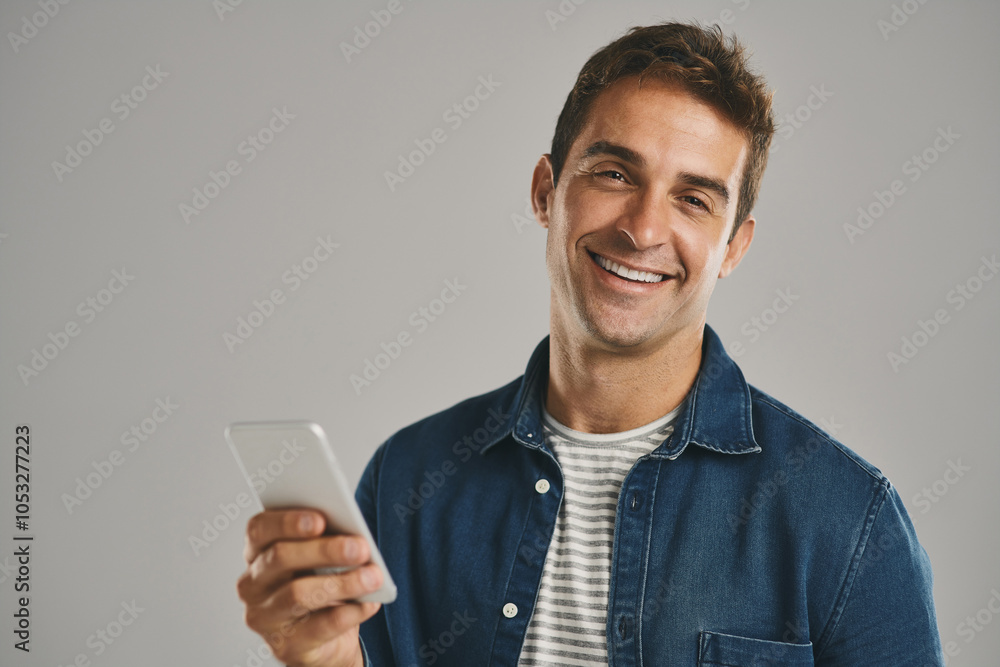 Poster Portrait, smile and man with smartphone, typing and internet with person on gray studio background. Face, guy and happy model with cellphone, social media or message to contact, texting or connection