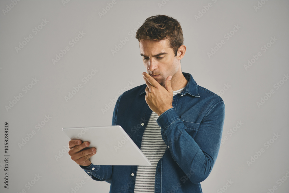 Poster Search, tablet and thinking with man in studio isolated on gray background for app download or update. Idea, planning and problem solving with confused user in casual outfit for online shopping