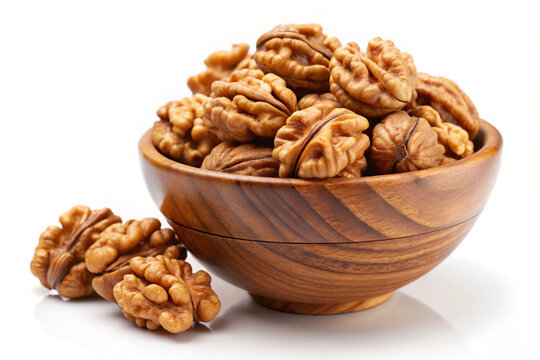 Walnuts in a bowl, isolated on white background