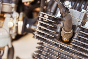 Fototapeta premium detailed close up view of a motorcycle engine featuring a spark plug