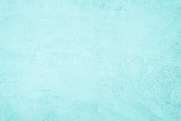 Grungy blue textured paper background with faded watercolor paint stains.