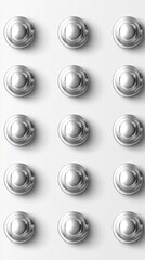 A grid of 15 round, silver metallic objects arranged in 5 rows of 3 on a plain white background.