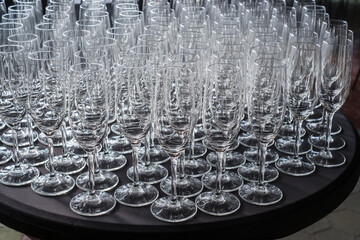Table full of empty champagne glasses. Welcome drink. New Years party. 