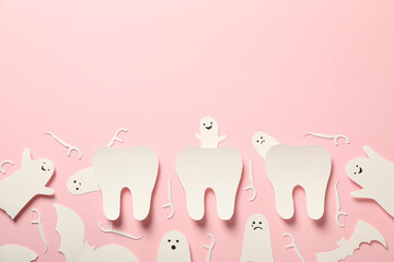  Ghost teeth on pink background, flat lay.