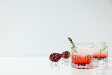 Cocktail with fresh pomegranate on a white background